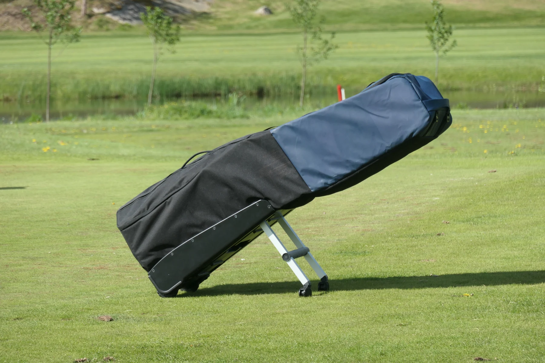 Full-scale Db golf travel-bag prototype with fold-out support wheels