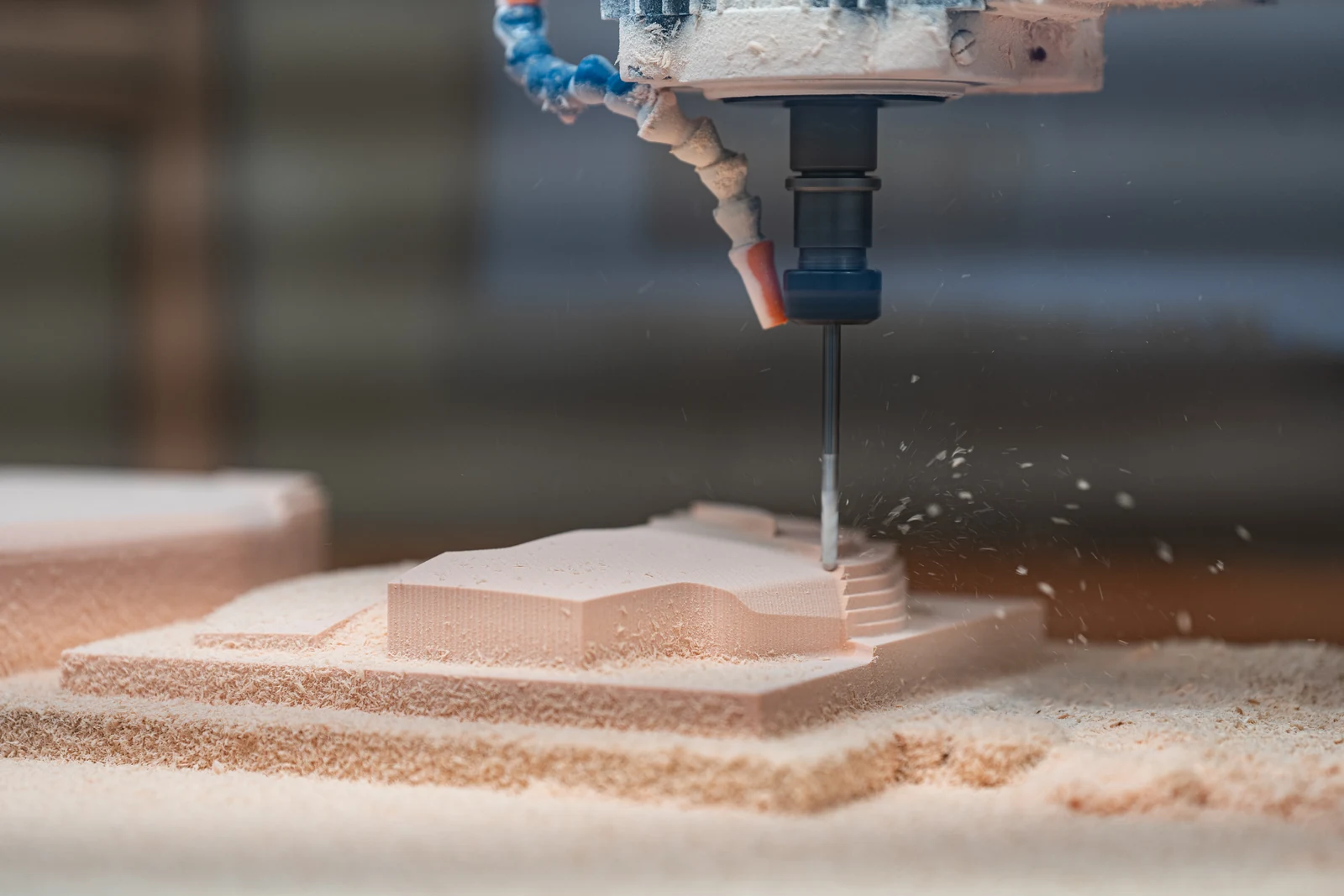 CNC tool milling the robot vacuum’s foam body