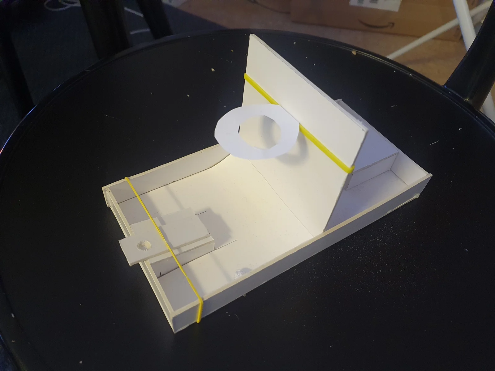 Early physical prototype of the tabletop game's launcher and frame
